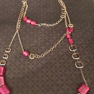 Silver toned necklace with pink stones